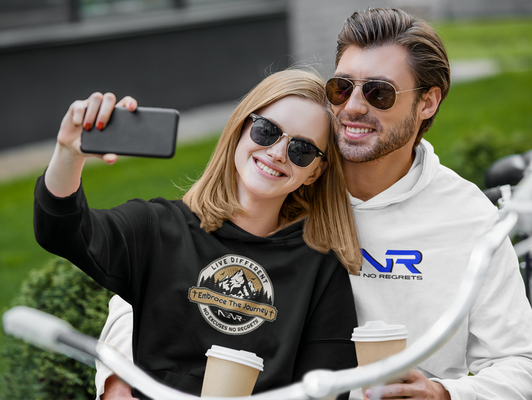 A classy couple wearing NENR hoodies talking a selfie