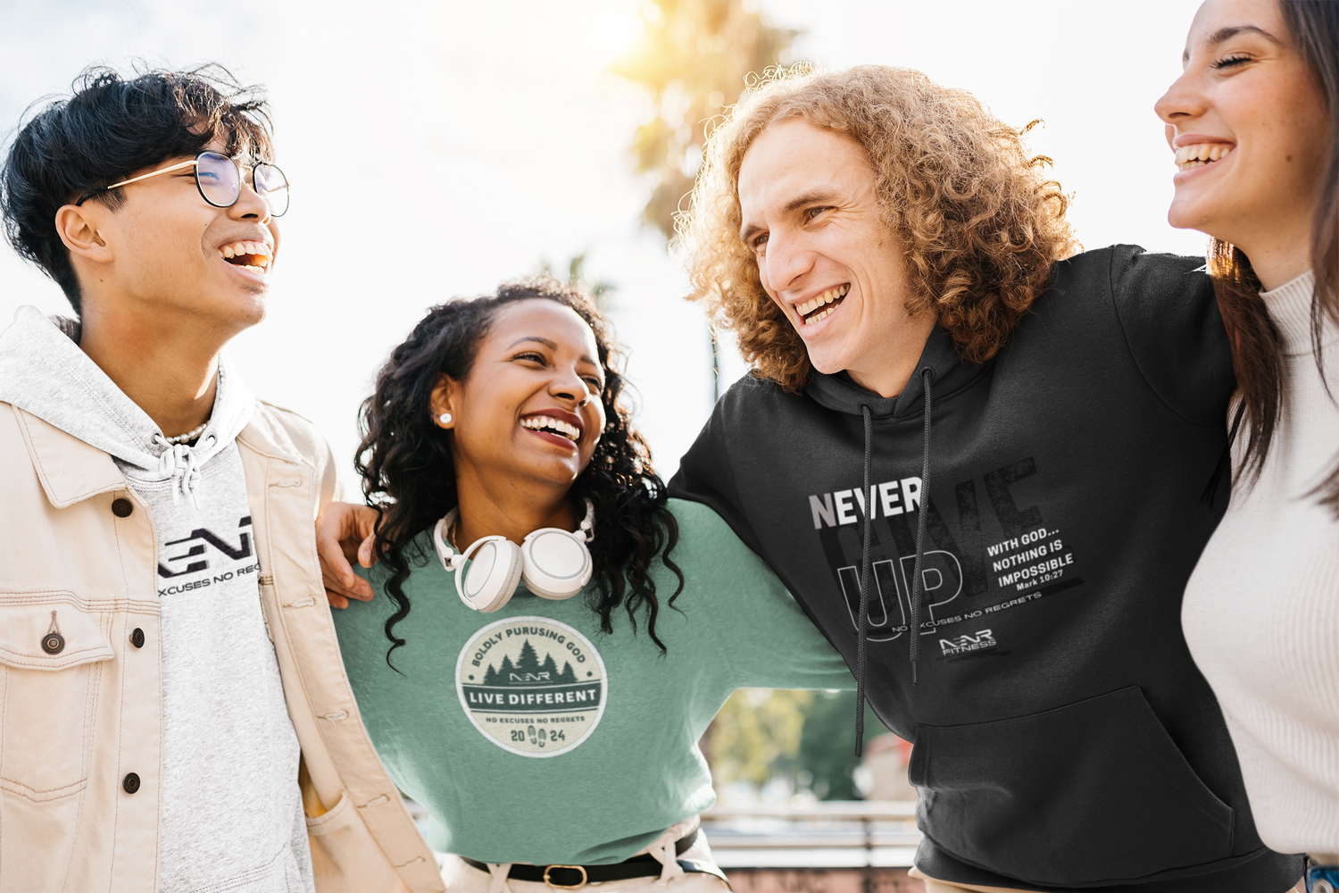A group of friends wearing NENR hoodies at the park